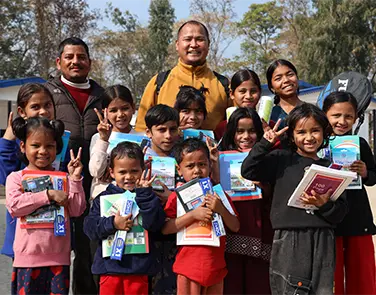 Children and volunteers with Shenpen education materials